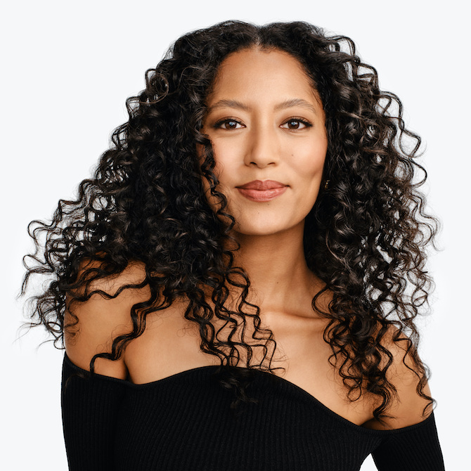 Model with dark brown, curly hair