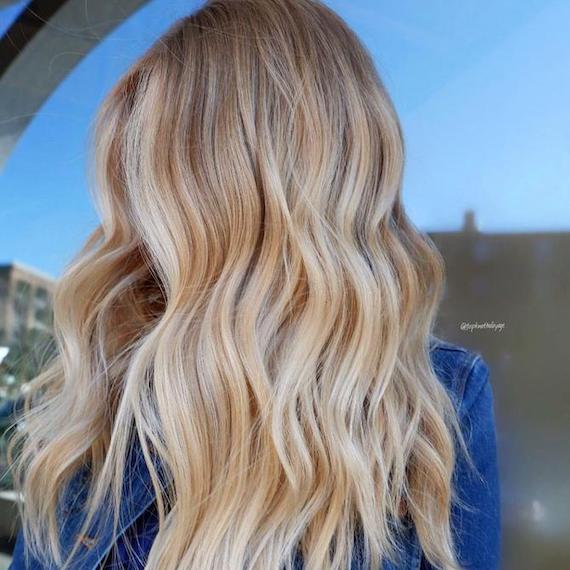 Woman with butter blonde hair, created using Wella Professionals