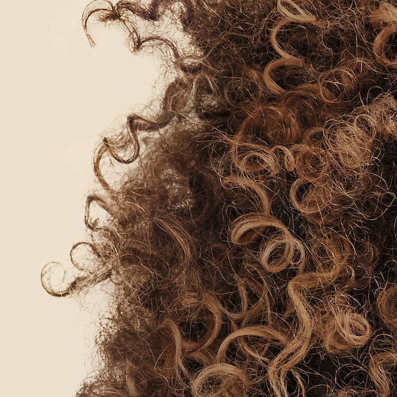 Close-up of type 4 curly hair texture.
