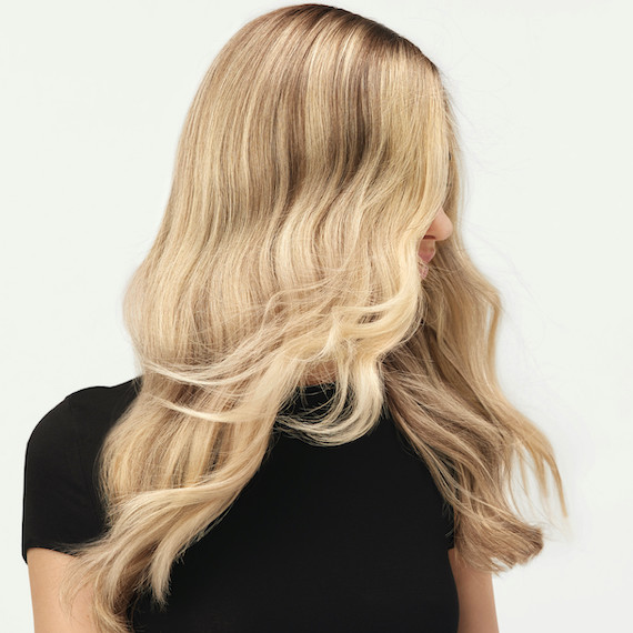 Model flicks her golden blonde hair