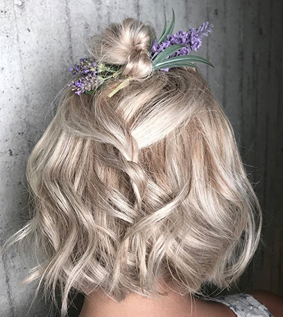 Model with short icy blonde hair and highlights created with Freelights, Illumina Color and Welloxon Perfect