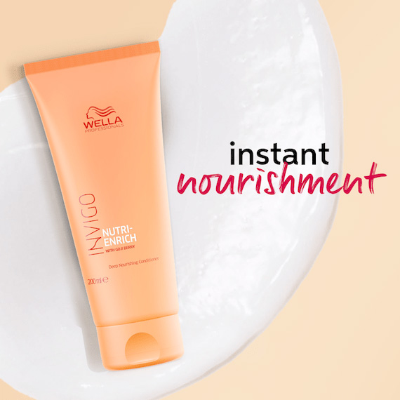 Eine Flasche des INVIGO Nutri-Enrich Conditioners.