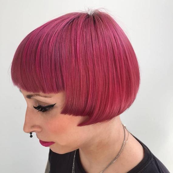 Woman with pink micro bob, created using Wella Professionals