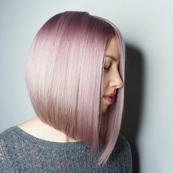 Woman with short, pink bob, created using Wella Professionals