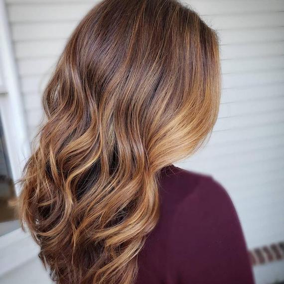 A person with long, wavy bronde hair