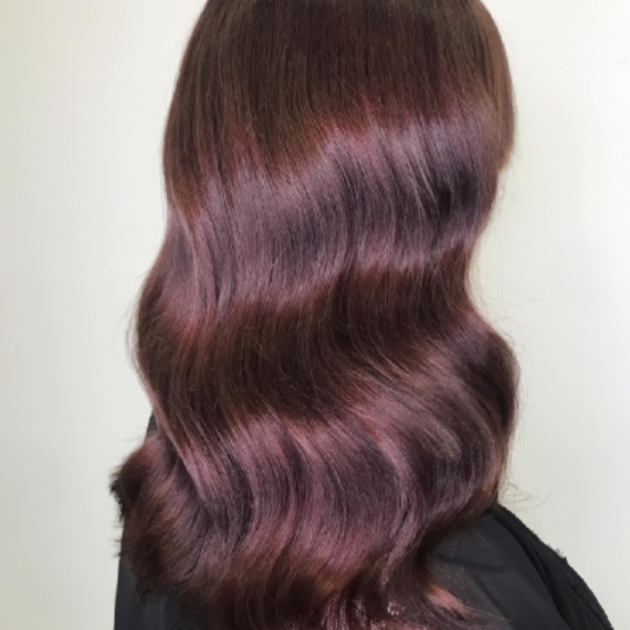 Woman with long, chestnut red brown hair, created with Wella Professionals