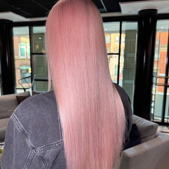 Model with long, straight, pastel rose hair.