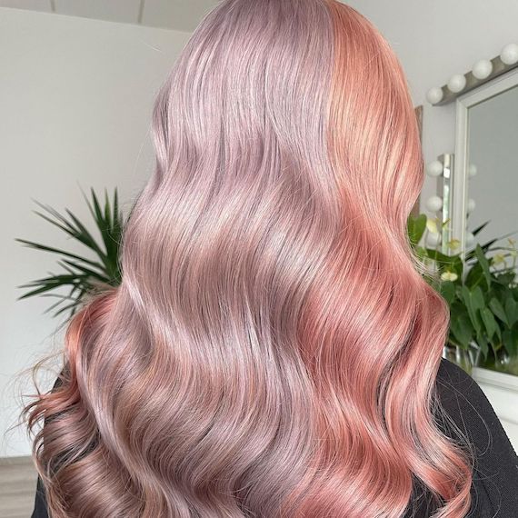 Model with pastel pink and lilac color block hair.