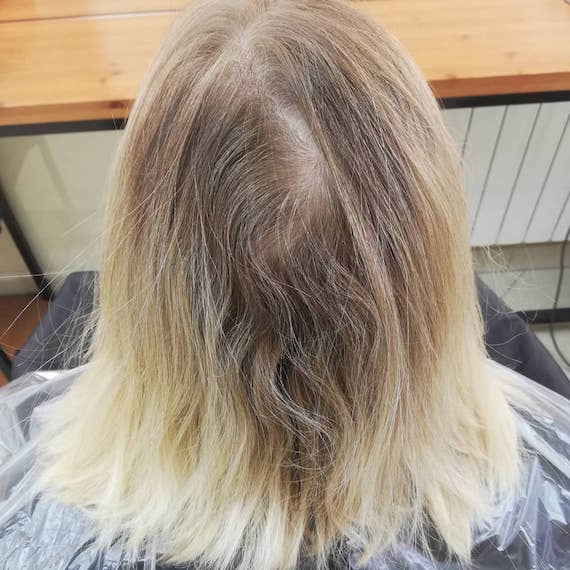 Photo of blonde bob with deep gray roots.
