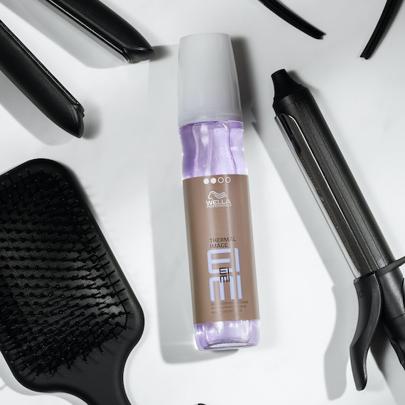 EIMI Thermal Image surrounded by hair tools and brushes.