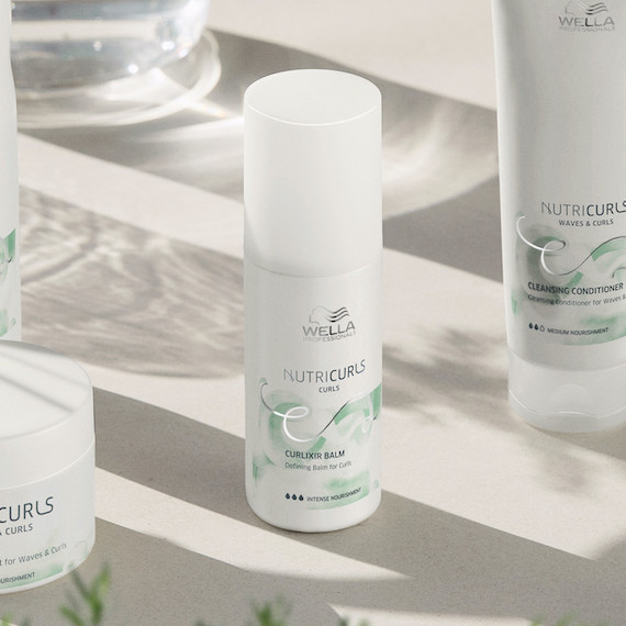 Bottle of Wella NutriCurls Curlixir Balm on a white background.