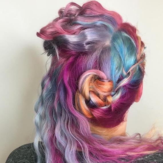 Back of a woman’s head showing crimped rainbow hair inspired by unicorns, created using Wella Professionals.