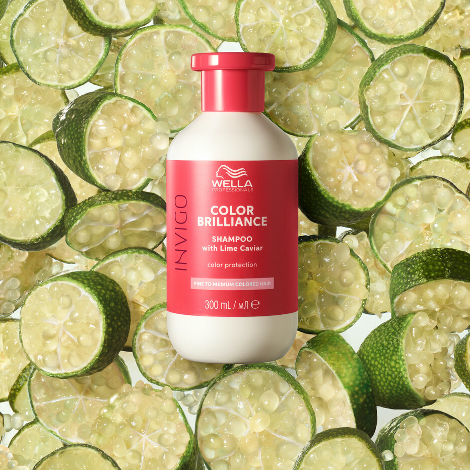 INVIGO Color Brilliance Color Protection Shampoo surrounded by slices of lime.