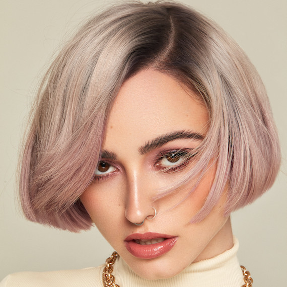 Model with ashy blonde, bob haircut.