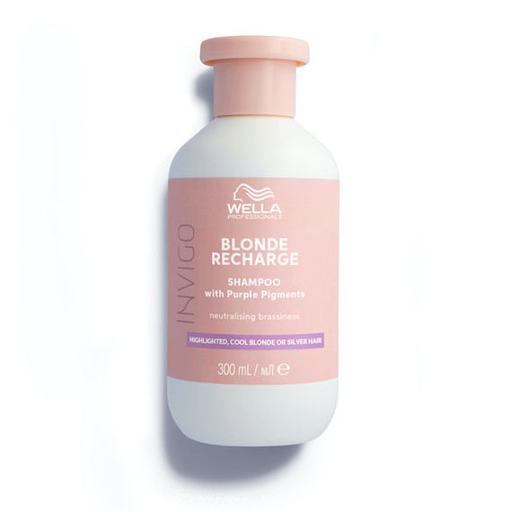 A bottle of INVIGO Blonde Recharge Cool Blonde Shampoo.