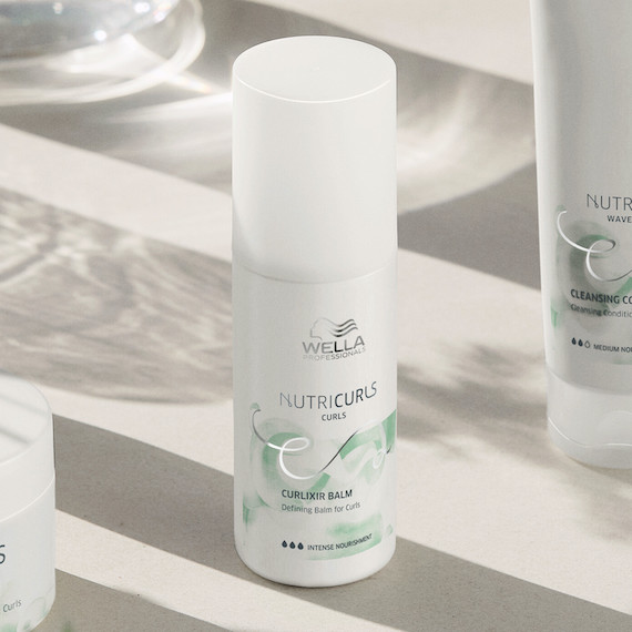 NutriCurls Curlixir Balm on a white surface.