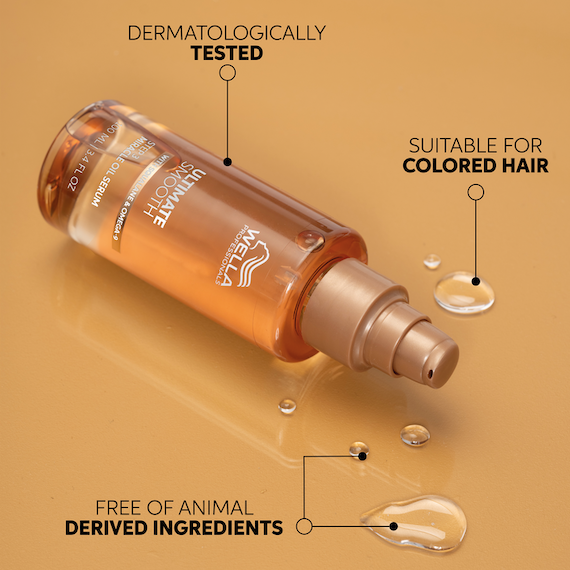 A bottle of ULTIMATE SMOOTH Miracle Oil Serum on a golden surface. The delicate oil is dermatologically tested, suitable for colored hair and free of animal-derived ingredients.