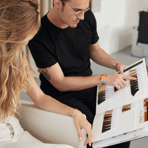 Hair colorist carries out consultation in Wella salon.