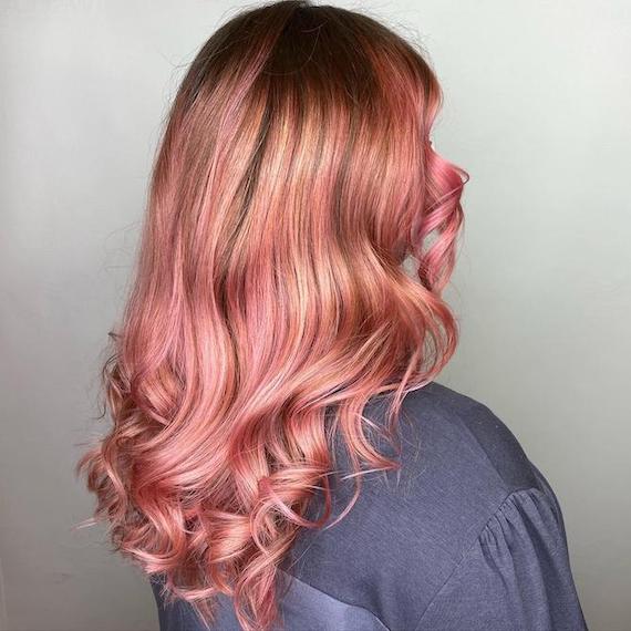 Back of woman’s head with long, rose gold hair, created using Wella Professionals.