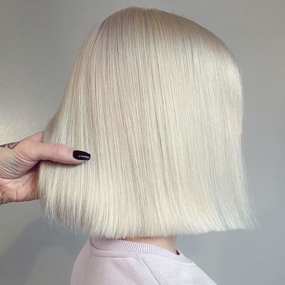‘After’ shot showing back of model’s head with short, nordic blonde hair.