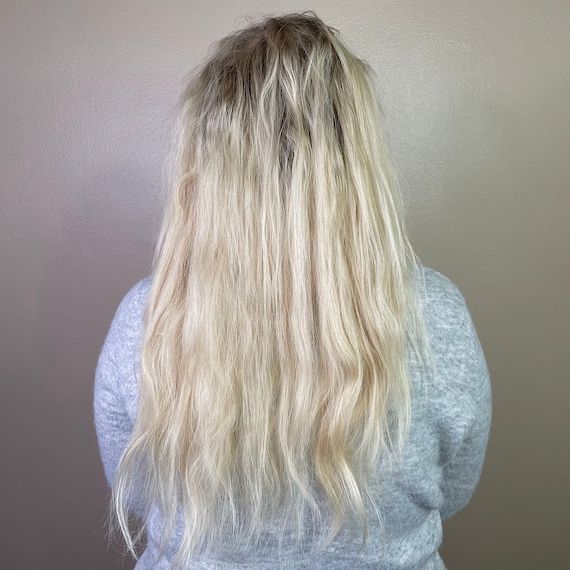 ‘Before’ shot showing model’s light blonde hair with regrowth.
