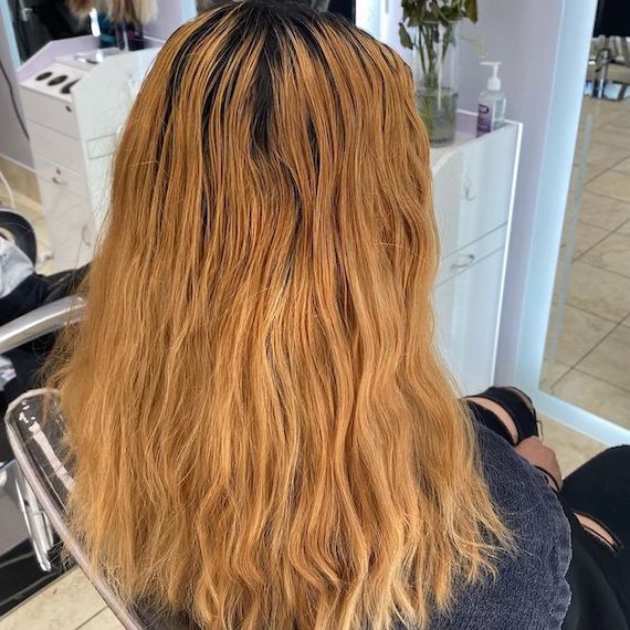 ‘Before’ shot showing model’s long, warm-toned blonde hair.