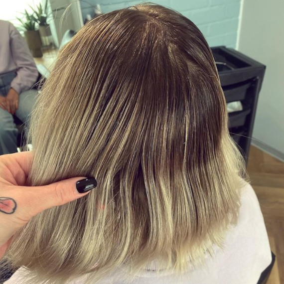 ‘Before’ shot showing model’s ash blonde hair with dark, grown-out roots.