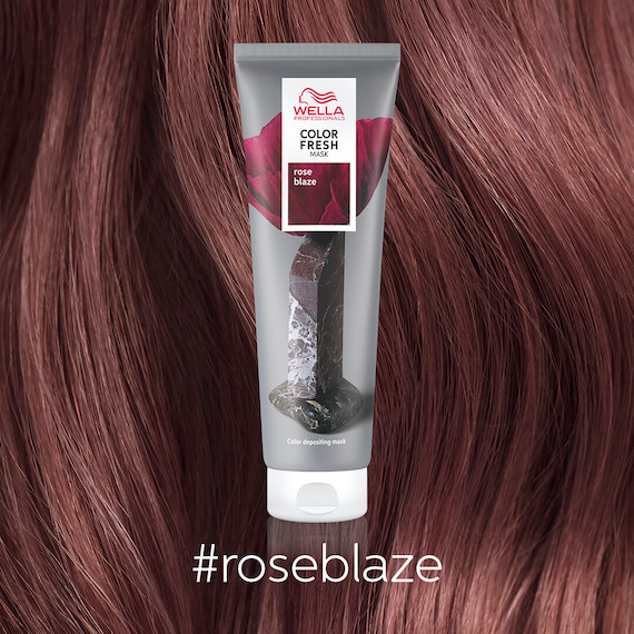 Close-up of model’s dark pink hair.