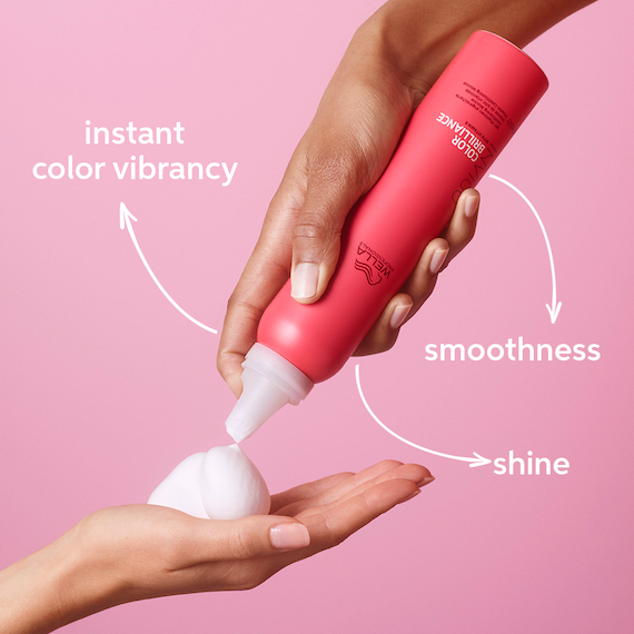 INVIGO Color Brilliance Vitamin Conditioning Mousse is sprayed into hand.