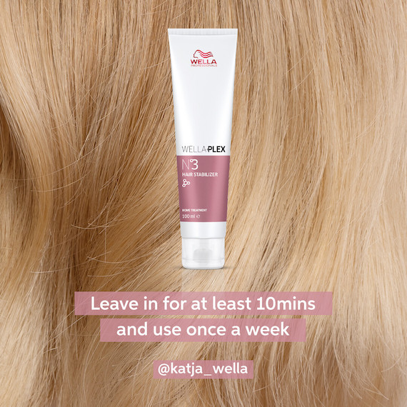 Close-up of strawberry blonde hair with a bottle of Wella Professionals WellaPlex No3 at the forefront