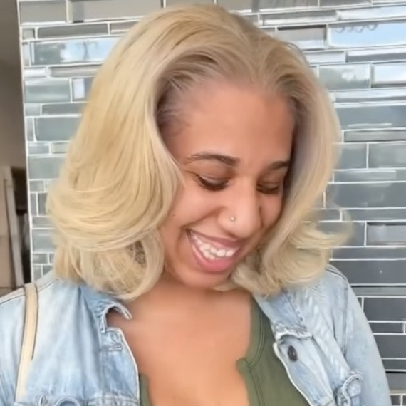 Model with shoulder-length, honey blonde hair styled with a glossy blow dry.