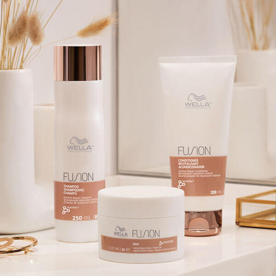 Fusion Shampoo Conditioner and Mask in a white bathroom.