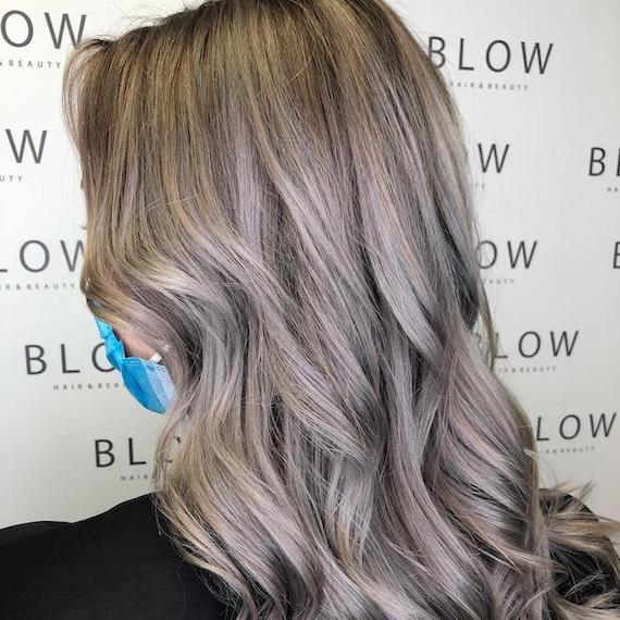 Back of woman’s head with silver blonde hair, created using Wella Professionals.