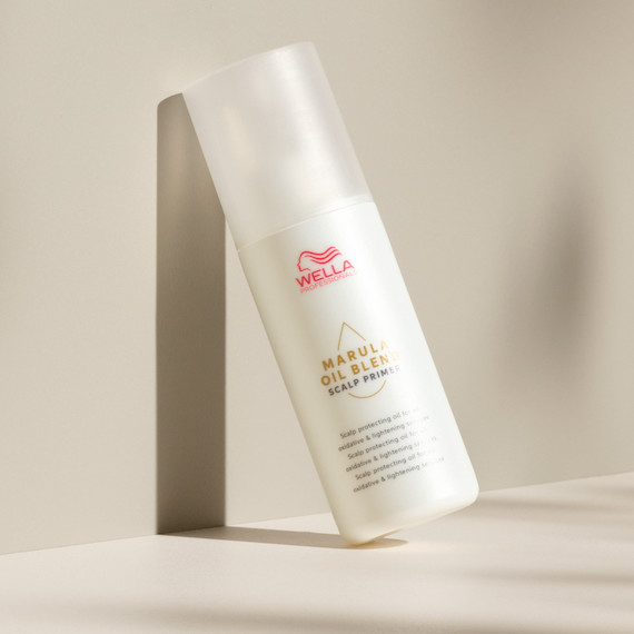 A bottle of Marula Oil Blend Scalp Primer.
