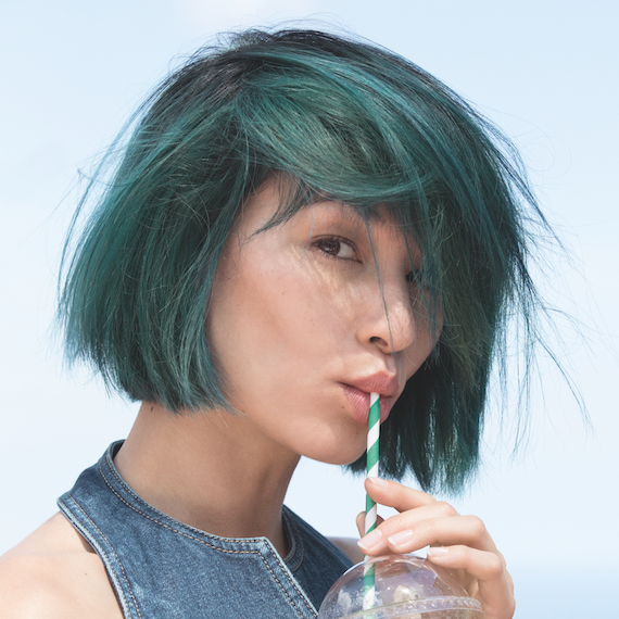 Model wearing green mermaid hair, created by Wella Professionals
