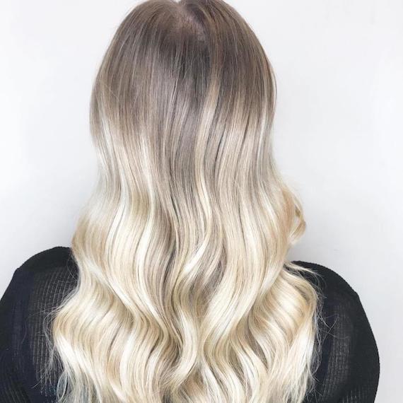 Image of woman with toasted coconut hair created using Wella Professionals products