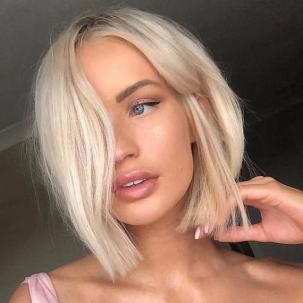 Model with short, blonde bob haircut.
