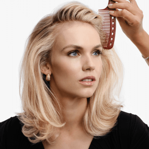 Model with mid-length, blonde, glossy hair. 