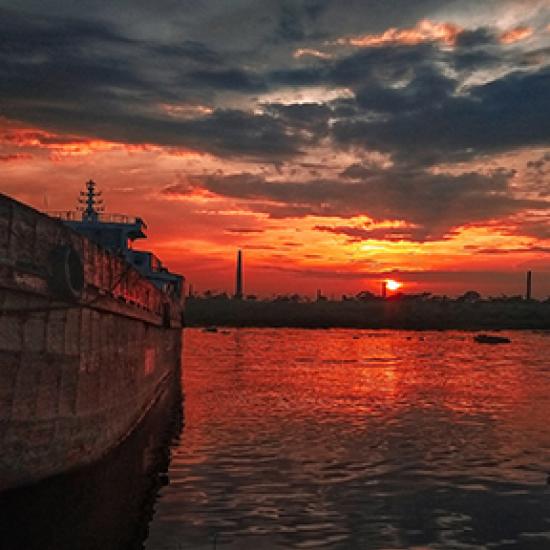 Red sunset over sea and boat