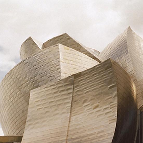 side of curved beige building 