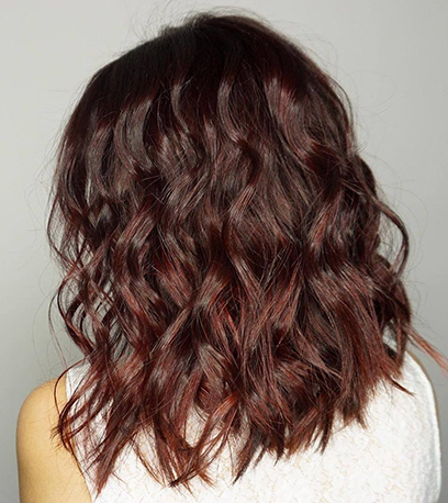 Shimmering mulled wine hair, created using Wella Professionals