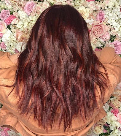 Wavy mulled wine hair, created using Wella Professionals