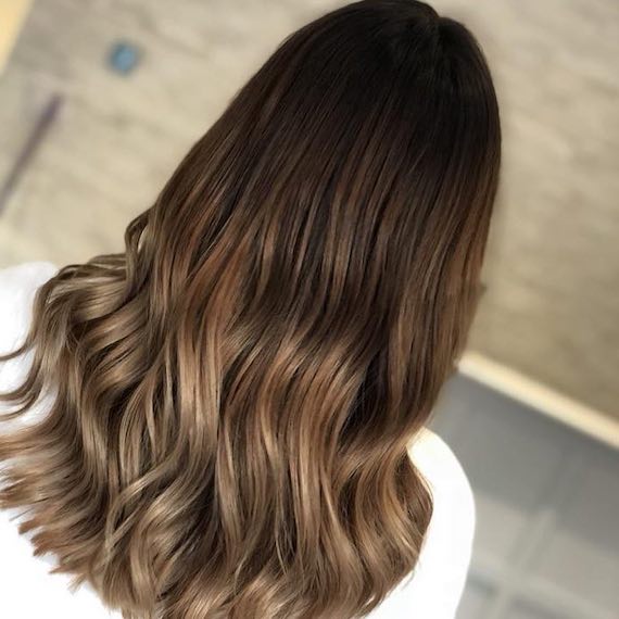 back of woman’s head with ash brown ombre hair,created with Wella Professionals