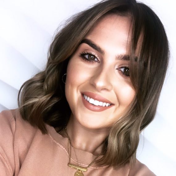 Woman with wavy hair and smoky ends, created with Wella Professionals