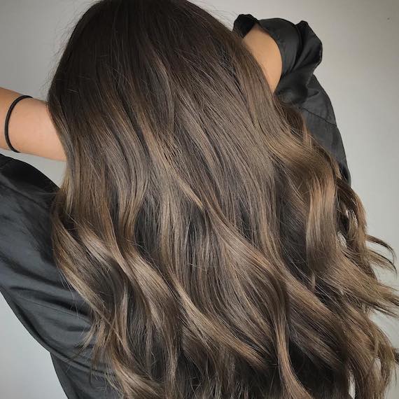Back of woman’s head with long ash brown hair,created with Wella Professionals