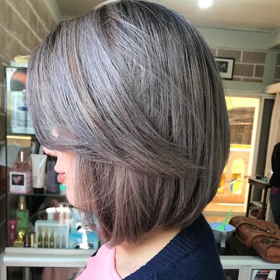 side profile of woman with bob hair with ash accents, created with Wella Professionals