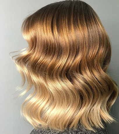 Image of shiny butterscotch blonde hair, created using Wella Professionals