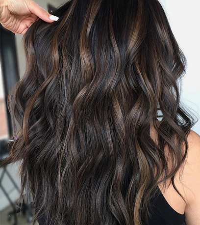 Wavy chili chocolate hair, created using Wella Professionals
