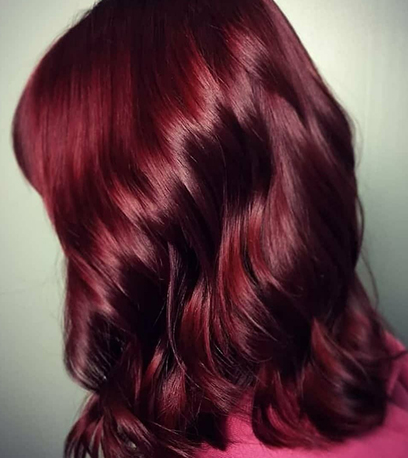 Side profile of mulled wine hair, created using Wella Professionals.