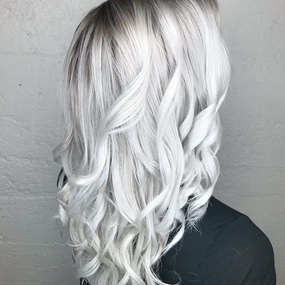 Woman with long wavy ice blonde hair